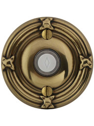 Doorbell Button with Ribbon and Reed Rosette in Antique Brass.